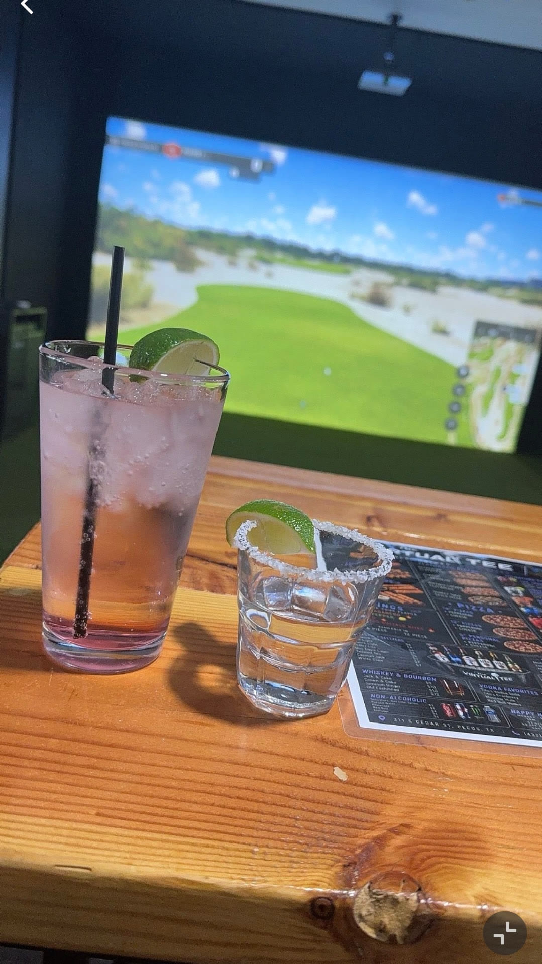 Cocktails beside a simulator bay at The Virtual Tee
